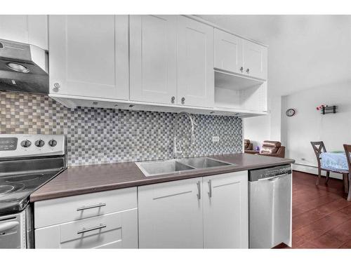 451-1620 8 Avenue Nw, Calgary, AB - Indoor Photo Showing Kitchen With Double Sink