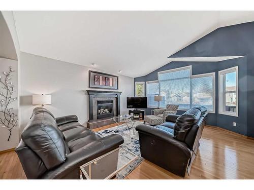 60 Brightondale Close Se, Calgary, AB - Indoor Photo Showing Living Room With Fireplace