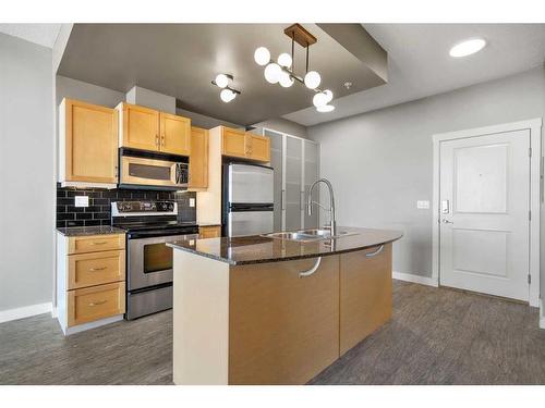 6310-11811 Lake Fraser Drive Se, Calgary, AB - Indoor Photo Showing Kitchen With Stainless Steel Kitchen With Double Sink