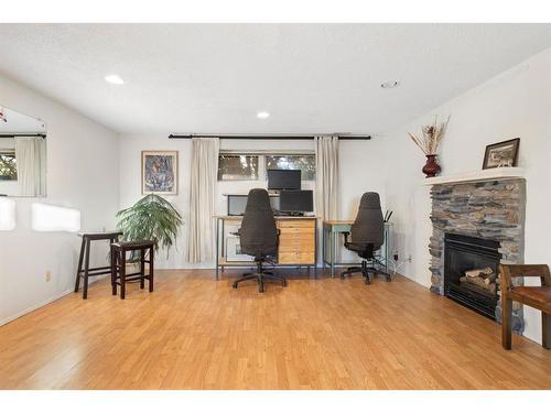 40 Thornaby Crescent Nw, Calgary, AB - Indoor Photo Showing Other Room With Fireplace