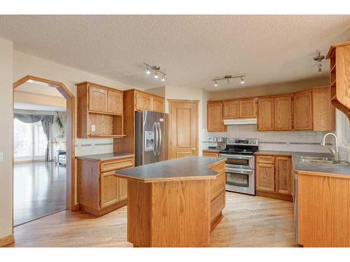 348 Sienna Park Drive Sw, Calgary, AB - Indoor Photo Showing Kitchen With Stainless Steel Kitchen With Double Sink