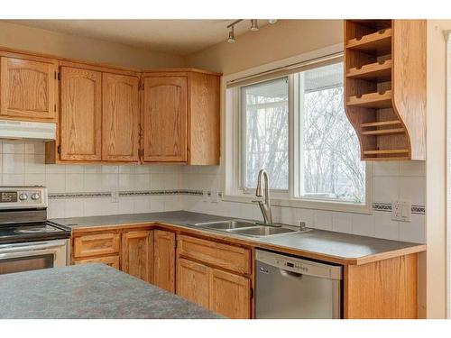 348 Sienna Park Drive Sw, Calgary, AB - Indoor Photo Showing Kitchen With Double Sink