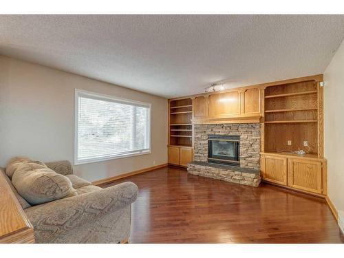 348 Sienna Park Drive Sw, Calgary, AB - Indoor Photo Showing Living Room With Fireplace