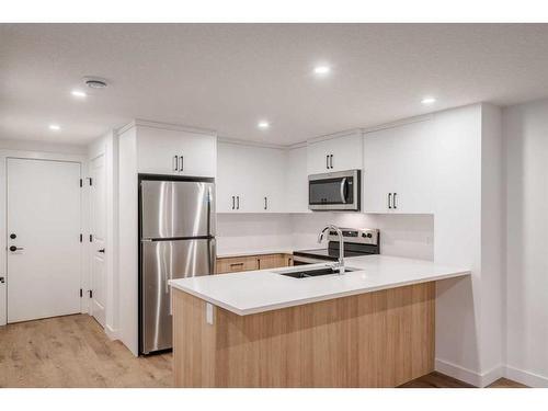 8 Royston Walk Nw, Calgary, AB - Indoor Photo Showing Kitchen With Double Sink