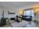 145 Arbour Crest Heights Nw, Calgary, AB  - Indoor Photo Showing Living Room 