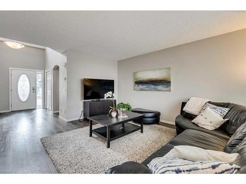 145 Arbour Crest Heights Nw, Calgary, AB - Indoor Photo Showing Living Room