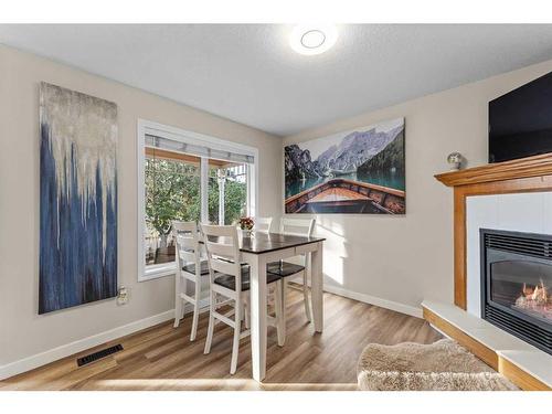 107 Tuffy'S Haven, Strathmore, AB - Indoor Photo Showing Dining Room With Fireplace