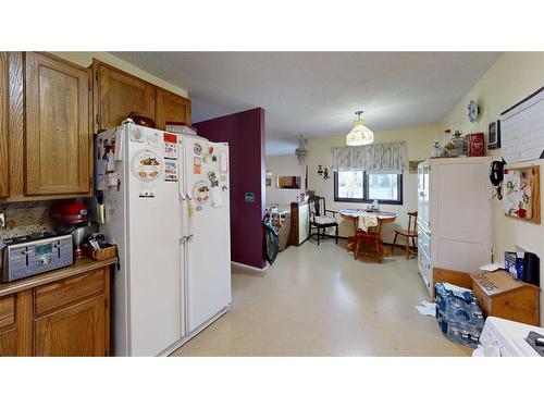 103 Slade Drive, Nanton, AB - Indoor Photo Showing Kitchen