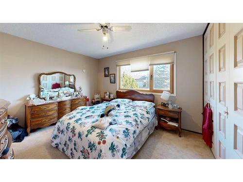 103 Slade Drive, Nanton, AB - Indoor Photo Showing Bedroom