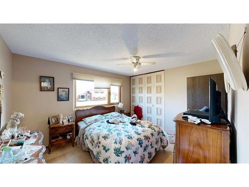 103 Slade Drive, Nanton, AB - Indoor Photo Showing Bedroom