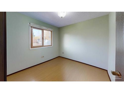 103 Slade Drive, Nanton, AB - Indoor Photo Showing Other Room