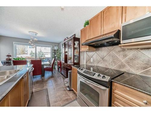 1044 Kincora Drive Nw, Calgary, AB - Indoor Photo Showing Kitchen With Stainless Steel Kitchen With Double Sink