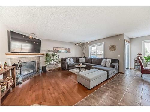 1044 Kincora Drive Nw, Calgary, AB - Indoor Photo Showing Living Room With Fireplace