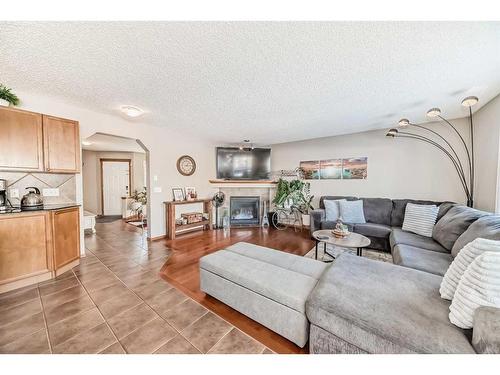 1044 Kincora Drive Nw, Calgary, AB - Indoor Photo Showing Living Room With Fireplace