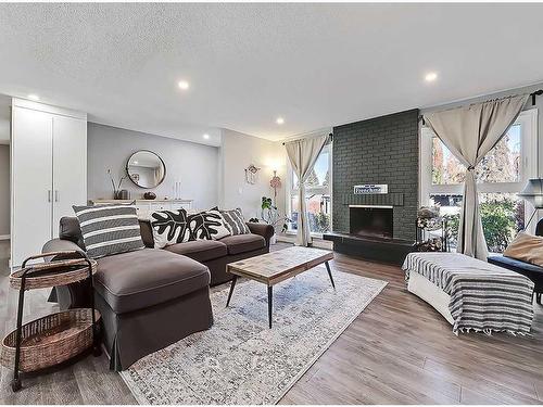 427 Cedarpark Drive Sw, Calgary, AB - Indoor Photo Showing Living Room With Fireplace