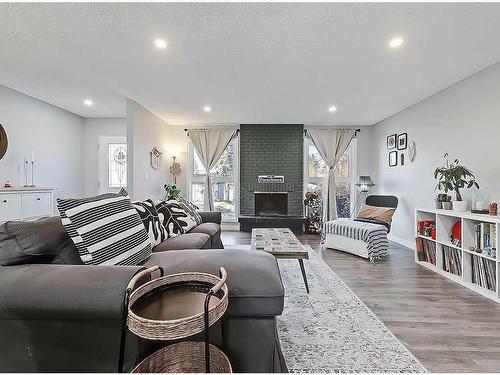 427 Cedarpark Drive Sw, Calgary, AB - Indoor Photo Showing Living Room With Fireplace