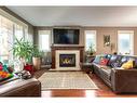 6616 Bowness Road Nw, Calgary, AB  - Indoor Photo Showing Living Room With Fireplace 