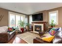 6616 Bowness Road Nw, Calgary, AB  - Indoor Photo Showing Living Room With Fireplace 