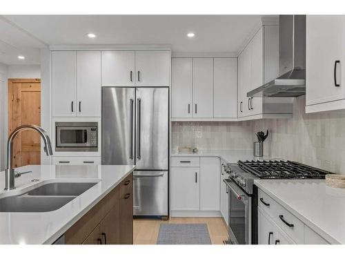 306-1315 Spring Creek Gate, Canmore, AB - Indoor Photo Showing Kitchen With Double Sink With Upgraded Kitchen