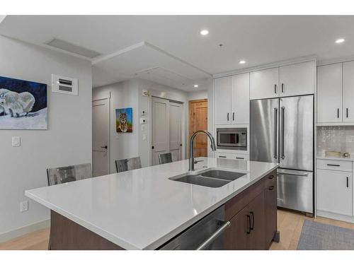 306-1315 Spring Creek Gate, Canmore, AB - Indoor Photo Showing Kitchen With Double Sink With Upgraded Kitchen