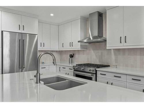 306-1315 Spring Creek Gate, Canmore, AB - Indoor Photo Showing Kitchen With Double Sink With Upgraded Kitchen