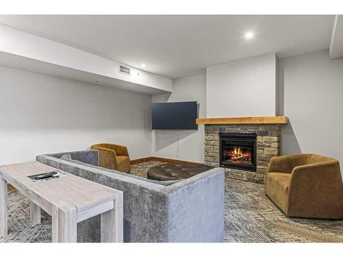 306-1315 Spring Creek Gate, Canmore, AB - Indoor With Fireplace