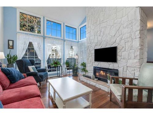 6-28 Berwick Crescent Nw, Calgary, AB - Indoor Photo Showing Living Room With Fireplace