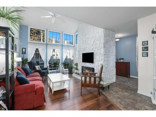 6-28 Berwick Crescent Nw, Calgary, AB - Indoor Photo Showing Living Room With Fireplace