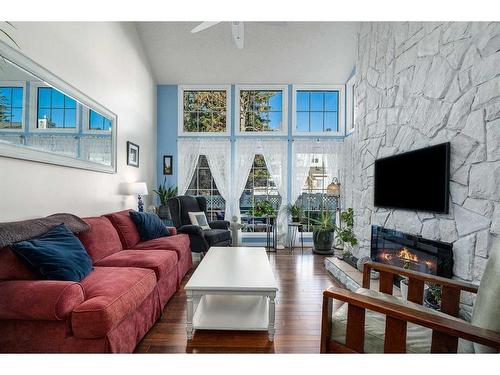 6-28 Berwick Crescent Nw, Calgary, AB - Indoor Photo Showing Living Room With Fireplace