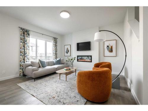 136 Sora Terrace Se, Calgary, AB - Indoor Photo Showing Living Room With Fireplace