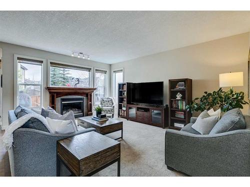 122 Cranridge Heights Se, Calgary, AB - Indoor Photo Showing Living Room With Fireplace