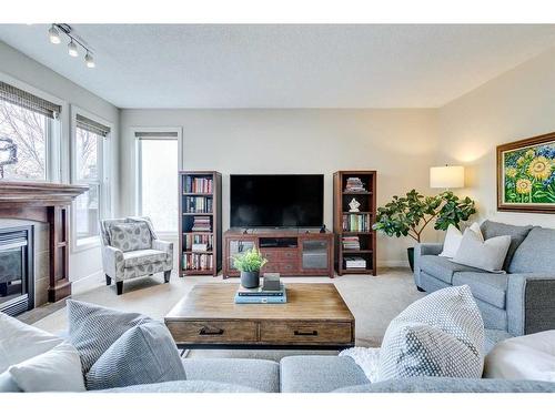 122 Cranridge Heights Se, Calgary, AB - Indoor Photo Showing Living Room With Fireplace