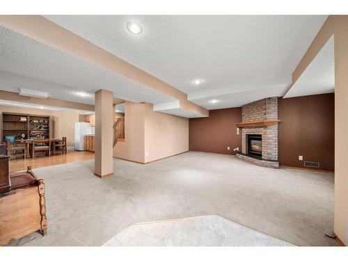 28 Macewan Park Close Nw, Calgary, AB - Indoor Photo Showing Other Room With Fireplace