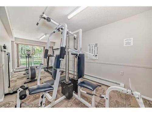 401-5000 Somervale Court Sw, Calgary, AB - Indoor Photo Showing Gym Room