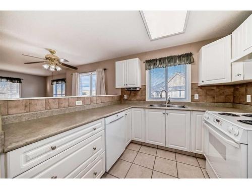 401-5000 Somervale Court Sw, Calgary, AB - Indoor Photo Showing Kitchen With Double Sink