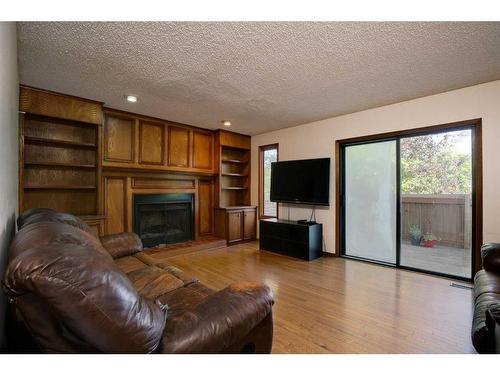 88 Macewan Glen Drive Nw, Calgary, AB - Indoor Photo Showing Living Room With Fireplace