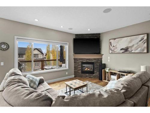 209 Hidden Creek Road Nw, Calgary, AB - Indoor Photo Showing Living Room With Fireplace