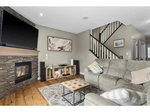 209 Hidden Creek Road Nw, Calgary, AB - Indoor Photo Showing Living Room With Fireplace