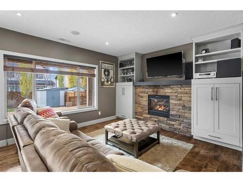 209 Hidden Creek Road Nw, Calgary, AB - Indoor Photo Showing Living Room With Fireplace