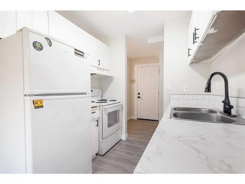 5617 60 Avenue, Red Deer, AB - Indoor Photo Showing Kitchen With Double Sink