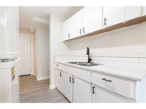 5617 60 Avenue, Red Deer, AB - Indoor Photo Showing Kitchen With Double Sink