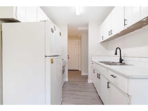 5617 60 Avenue, Red Deer, AB - Indoor Photo Showing Kitchen With Double Sink