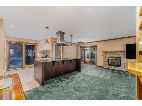 219 Northmount Drive Nw, Calgary, AB - Indoor Photo Showing Kitchen With Fireplace