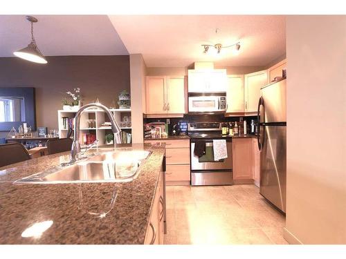 1410-5605 Henwood Street Sw, Calgary, AB - Indoor Photo Showing Kitchen With Double Sink