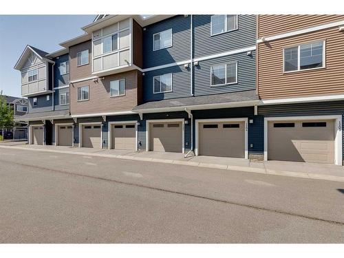 1204-1225 Kings Heights Way Se, Airdrie, AB - Outdoor With Facade