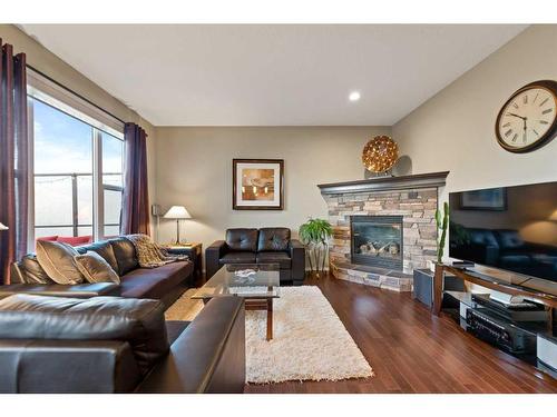 78 Brightonwoods Grove Se, Calgary, AB - Indoor Photo Showing Living Room With Fireplace