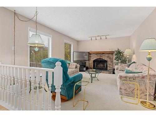 83 Edcath Road Nw, Calgary, AB - Indoor Photo Showing Living Room With Fireplace