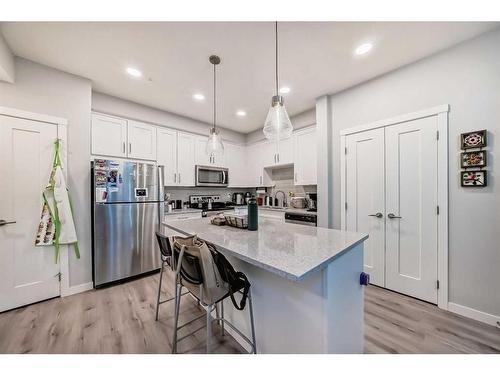 109-150 Shawnee Square Sw, Calgary, AB - Indoor Photo Showing Kitchen With Stainless Steel Kitchen With Upgraded Kitchen