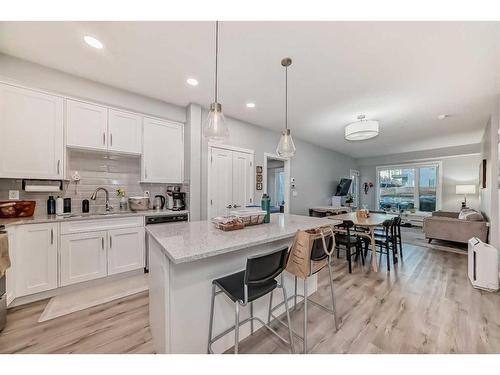 109-150 Shawnee Square Sw, Calgary, AB - Indoor Photo Showing Kitchen With Upgraded Kitchen