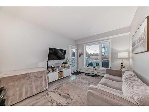 109-150 Shawnee Square Sw, Calgary, AB - Indoor Photo Showing Living Room